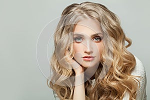 Perfect blonde woman with healthy curly hairstyle on white