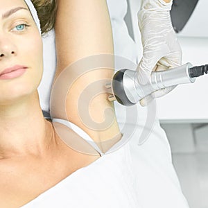 Perfect body radio treatment. Woman at spa procedure. Doctor hand and girl body. RF cosmetology lifting. Flabby hand