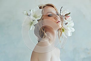 Perfect bride with jewels, a portrait of a girl in a long white dress. Beautiful hair and clean delicate skin. Wedding hairstyle