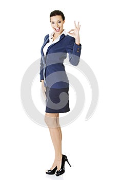 Perfect - business woman showing OK hand sign.