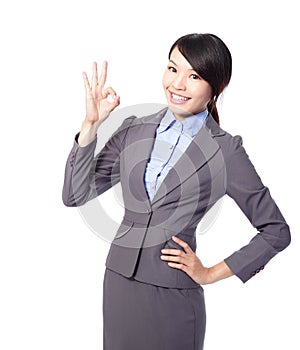 Perfect - business woman showing OK hand sign