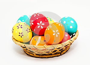 Perfect colorful handmade painted easter eggs in the basket isolated