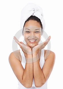 The perfect complexion. A beautiful young woman cupping her face in her hands.