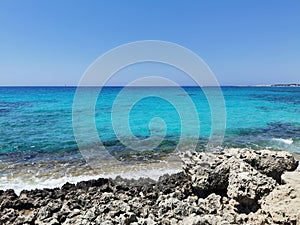 Perfect crystal clear blue water and a white rocky shore in a summer day , Cyprus