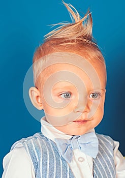 A perfect cut. Boy child with stylish blond hair. Healthy hair care habits. Small child with messy top haircut. Small