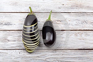 Perfect eggplants whole and sliced on white background