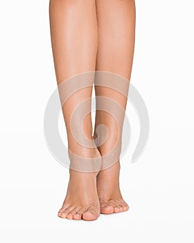 Perfect female legs isolated on white background