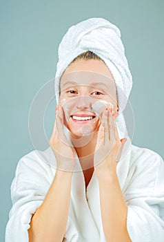 Perfect fresh clean skin concept. Young beautiful woman washing her face