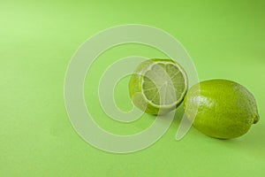 Perfect Fresh Green lime fruit Isolated on green Background Full Depth of Field