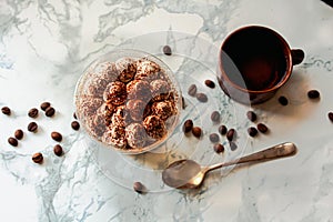 Perfect freshly made Italian tiramisu with cacao. Tiramisu portion on a white marble background. Delicious no bake tiramisu ready-