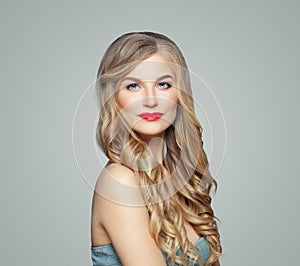 Perfect girl. Cute woman blonde with long fair hair and clear skin. Facial treatment, haircare and cosmetology concept