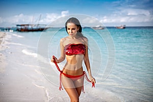 Perfect girl in swimsuit on the beach