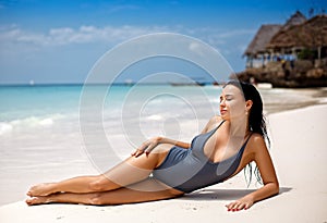 Perfect girl in swimsuit on the beach