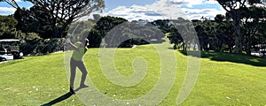 Perfect golf day male golfer on golf course with golf club and getting ready to hit