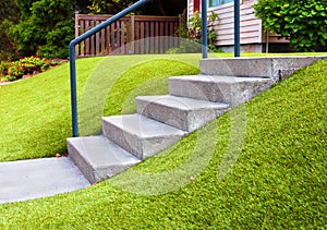 Perfect grass landscaping with artificial grass in residential area