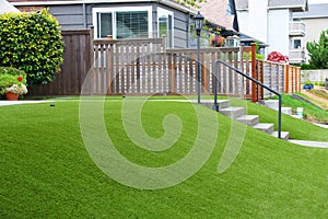 Perfect grass landscaping with artificial grass in residential area