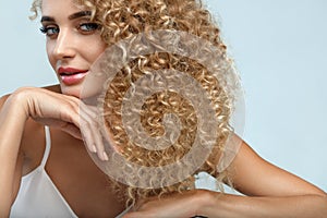 Perfect Hair. Beautiful Woman Model With Long Blonde Curly Hair