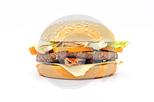 Perfect hamburger classic burger american cheeseburger with cheese, bacon, tomato and lettuce isolated on a white background.