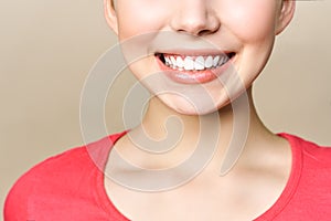 Perfect healthy teeth smile of a young woman. Teeth whitening. Dental clinic patient. Image symbolizes oral care