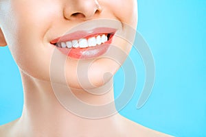 Perfect healthy teeth smile of a young woman. Teeth whitening. Dental clinic patient. Stomatology, dentistry concept.