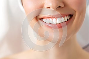 Perfect healthy teeth smile of a young woman. Teeth whitening. Image symbolizes oral care dentistry,