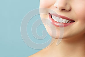 Perfect healthy teeth smile of a young woman. Teeth whitening. Stomatology concept.