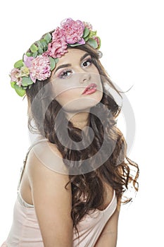 Perfect healthy woman with clean fresh skin, wavy long hair and flower wreath, beauty portrait