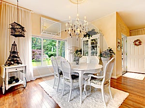 Perfect kitchen with white interior, yellow walls, and hardwood