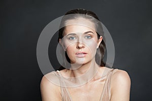 Perfect lady brunette portrait. Wellness model woman with healthy skin posing on black studio wall background