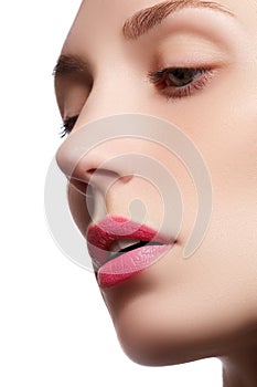 Perfect lips. Professional Make-up. Lipgloss. Closeup portrait of beautiful girl. Caucasian young woman model with bright makeup