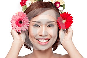 Perfect makeup. Beauty fashion. Spring woman. Beautiful asian woman with flower wreath on her head. Beauty girl with flowers hair