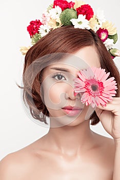 Perfect makeup. Beauty fashion. Spring woman. Beautiful asian woman with flower wreath on her head. Beauty girl with flowers hair
