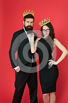 Perfect match. Elite society. Being recognised and proud. Proud couple. Woman and bearded man wear crowns. Selfish