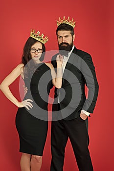 Perfect match. Elite society. Being recognised and proud. Proud couple. Woman and bearded man wear crowns. Selfish