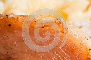 The perfect meat for a sportsman. Fried cooked chicken breast with spices close-up. Macro shooting