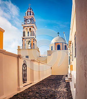 Perfect morning view of Catholic Cathedral Church of Saint John The Baptistm in Fira village, Greece, Europe. Sunny summer Santori