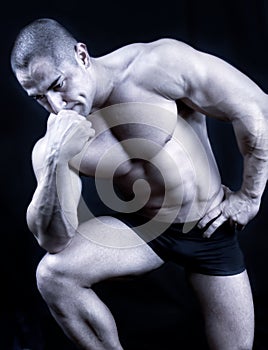 The Perfect muscular man posing isolated