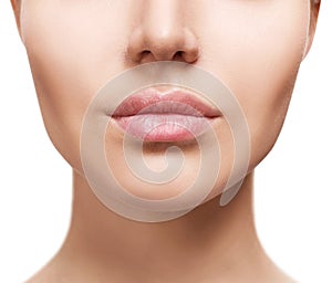 Perfect natural lips of young woman.