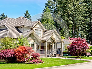 A perfect neighborhood. Luxury residential house with green lawn in front