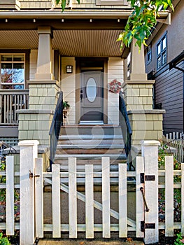 A perfect neighbourhood. Porch and entrance of a nice residential house