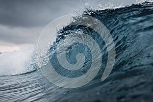 Perfect ocean waves with water cloudy dark sky