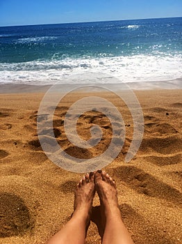 Perfect Paradise Feet up relaxing watching a glorious golden sunrise over the beach in Kauai Hawaii