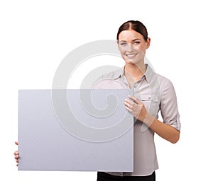 The perfect place for your copy. Cropped shot of an attractive young woman holding a blank sign isolated on white.