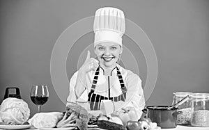 Perfect recipe. Turn ingredients into delicious meal. Culinary skills. Woman chef wear hat apron near table ingredients