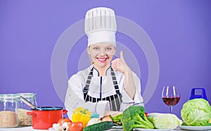 Perfect recipe. Turn ingredients into delicious meal. Culinary skills. Woman chef wear hat apron near table ingredients