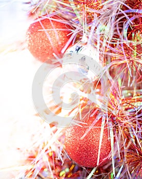 The perfect red metallic ball ornament hanging on the glister christmas tree and preparing for decorated for the Celebrate with