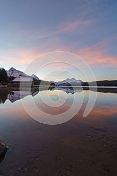 Perfect reflection in Maligne Lake, Jasper National Park. Alberta Canada