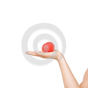 The perfect relaxation tool. Cropped view of a womans hand squeezing a stress ball against a white background.