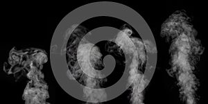 A perfect set of four different mystical curly white vapors or smoke on a black background. Abstract fog for halloween.