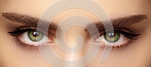 Perfect shape of eyebrows and extremly long eyelashes. Macro shot of fashion eyes visage. Before and after photo